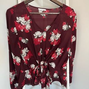 A large tie in front shirt from Maurice’s. It is see through